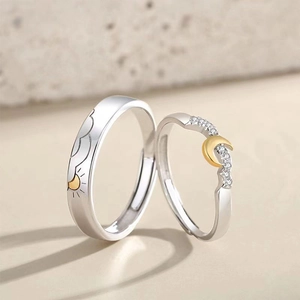 Elegant Sun and Moon couple rings set with textured patterns and sparkling zircons