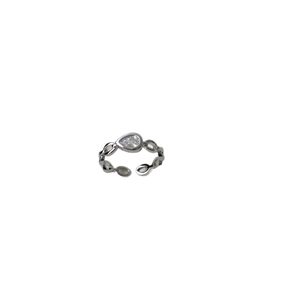 Minimalist chain link open ring with pear cut cubic zirconia stone on white background