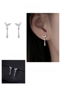 Detailed view of silver leaf stud earrings with sparkling cubic zirconia and water drop tassels