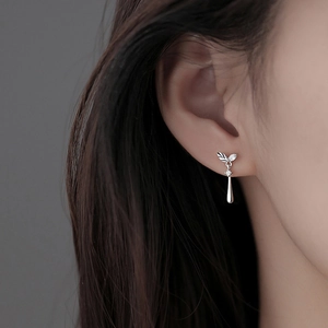 Leaf zircon stud earrings with silver water drop tassels in a minimalist elegant style