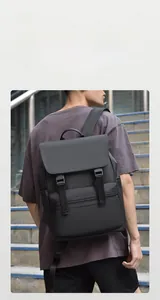 Detail of waterproof black business backpack with buckle straps and front zipper pocket