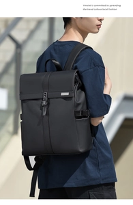 Side view of a black minimalist waterproof business backpack with roll-top and padded straps