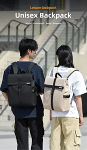 Modern black and beige roll-top backpacks shown in a lifestyle outdoor setting