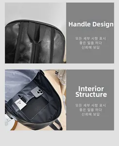 Detail view of reinforced handle and spacious interior compartments of leather backpack