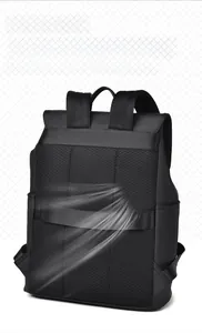 Detail of breathable honeycomb mesh back panel and luggage strap on black laptop backpack