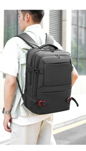 Close-up of a 19-inch black laptop backpack showing durable nylon fabric and side buckles