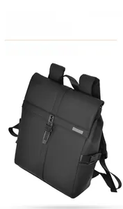 Close-up of black waterproof business travel backpack with tactical buckle and matte texture