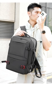 Black 19-inch travel backpack detail with red buckles and external USB charging port