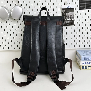 Large black faux leather laptop backpack with adjustable straps for travel and business