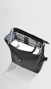 Detail view of the 26L black backpack interior with laptop compartment and ample storage