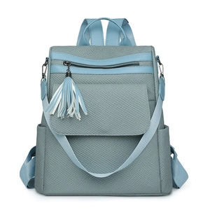 Faux leather woven backpack with tassel detail and adjustable straps in grey-blue finish