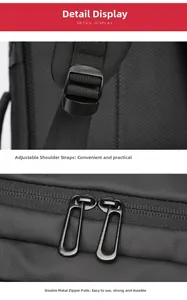 Close-up of padded shoulder straps with buckles and dual zippers on black laptop backpack