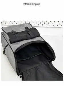 Internal display of the gray PU leather backpack showing organized multi-layered compartments