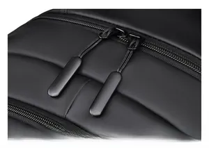 Detail of premium smooth dual zippers and waterproof matte fabric on the black backpack