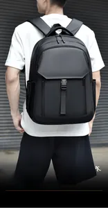 Detail of ergonomic padded shoulder straps on a black multifunctional laptop backpack