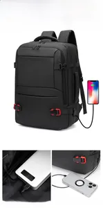 Detail view of the external USB charging port on this black 19-inch laptop backpack