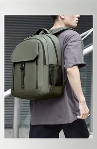 Olive green business backpack with ergonomic straps and side mesh pocket shown on model