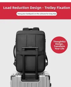 Detail view of the black travel backpack with a luggage strap fixed on a suitcase handle