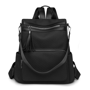 Fashionable black vintage commuter backpack for women with tassel and detachable strap