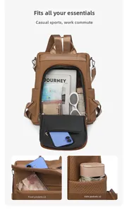 Detail view of khaki brown large capacity backpack with front zip pockets and side pouches