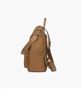 Side view of brown woven backpack showing side pocket, adjustable straps and metal buckles