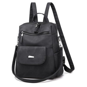 Detail of black multi-functional backpack with silver metal buckle and adjustable straps