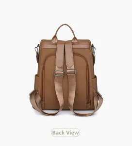Back view of brown vintage backpack showing durable nylon texture and anti-theft design