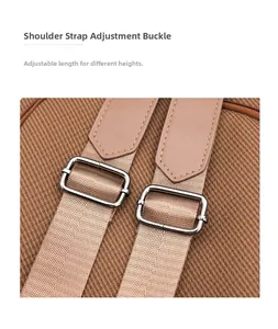 Detail of adjustable shoulder strap with silver metal buckle and brown canvas material