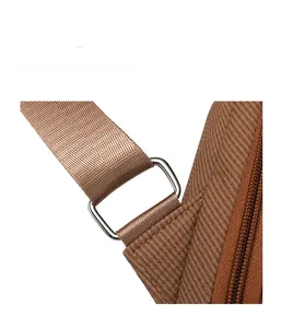 Detail of durable woven shoulder strap and polished metal buckle on vintage backpack