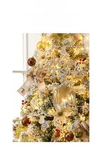 Detail of Christmas tree ornaments with wooden Merry Christmas sign and linen elk bows