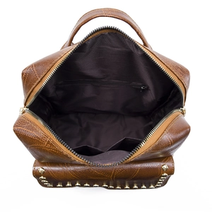 Detailed interior view of the brown PU leather backpack with pockets and metal rivets
