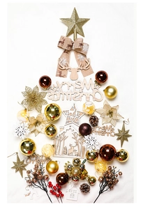 Close-up of golden ornaments, wooden carvings and pine cones for a 2.1m snowy Christmas tree