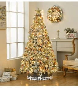 Detail of a 2.1m flocked Christmas tree with gold ornaments, warm lights, and deer fence