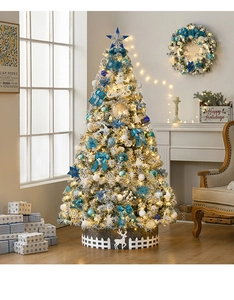 Detail of 2.1m snowy Christmas tree with blue ornaments and reindeer fence decor