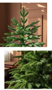 Gros plan détaillé des aiguilles PE vertes denses sur une branche de sapin de Noël artificiel