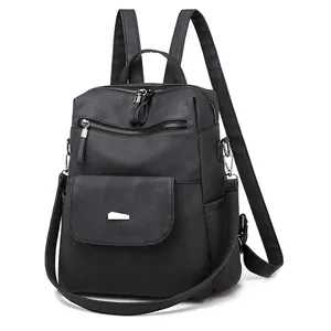 Versatile black PU leather women's backpack with multiple pockets and silver hardware