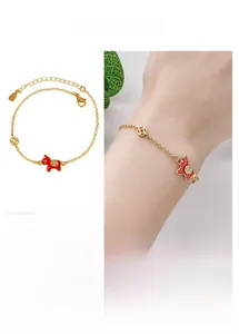 Detail of red enamel horse charm bracelet with adjustable chain and gold finish