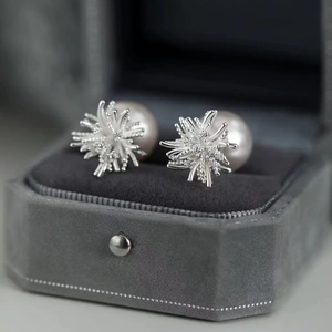 Elegant fireworks floral pearl stud earrings with zircon inlay in a velvet jewelry box