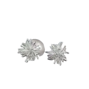 Elegant silver starburst pearl earrings with cubic zirconia in a modern asymmetric design