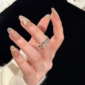 Elegant silver ring with teardrop tassels and zircons worn by a female model
