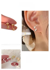 Close-up of double dolphin earrings with 3-position adjustable rear hanging structure