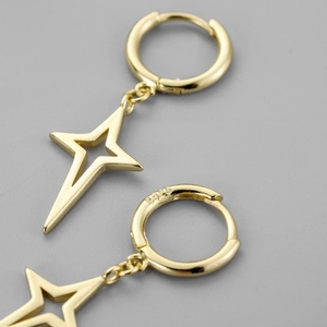 S925 sterling silver gold huggie earrings featuring hollow North Star compass charms