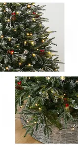 Detailed view of dense snowy Christmas tree branch with warm LED lights and pine cones