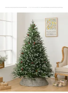 Detail of 1.8m snowy Christmas tree with red berries, pine cones and grey wicker fence