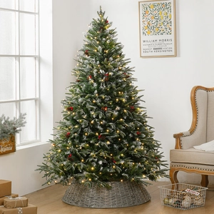 Illuminated PE Christmas tree with snow flocking, red berries, cones and wicker base