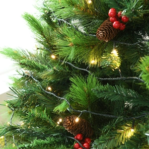 Green PVC pine Christmas tree with warm LED lights, natural pinecones and red berries