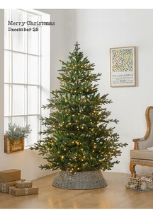 Detail of a 1.8m PE luxury Christmas tree with warm LED lights and grey woven tree base