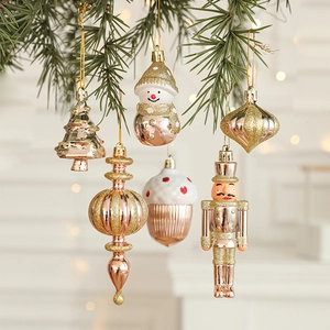 Champagne gold Christmas ornaments set with glitter finishes on pine branches