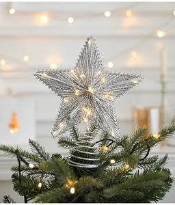 Silver hollow star tree topper with warm white LED lights and a stable spiral base