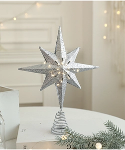 Silver glitter Christmas tree topper star with warm white LED lights and metal base